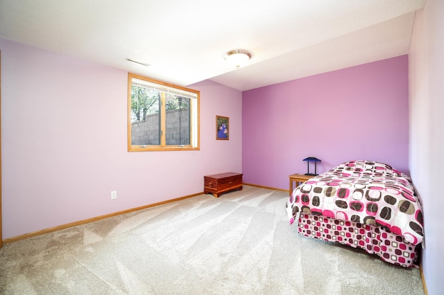 bedroom with carpet and baseboards