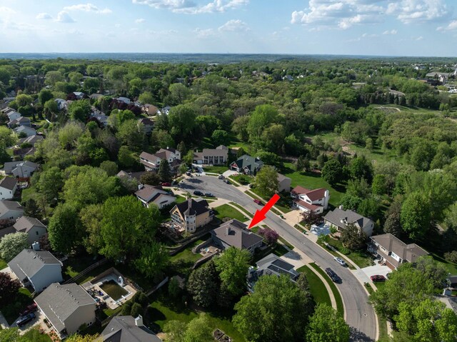 aerial view of property's location with nearby suburban area