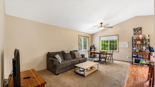 833 19th Ave N, Saint Cloud, MN 56303 - living room featuring lofted ceiling, ceiling fan, baseboards, and wood finished floors