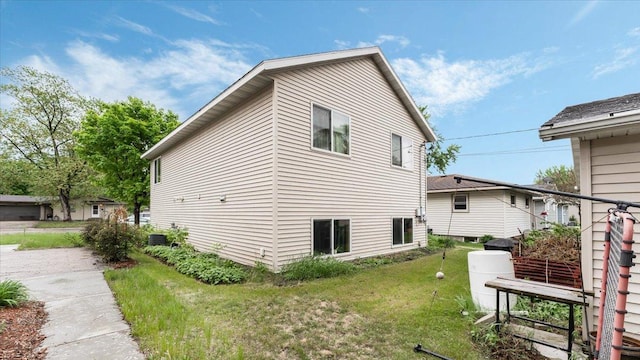 833 19th Ave N, Saint Cloud, MN 56303 - view of home's exterior featuring a lawn