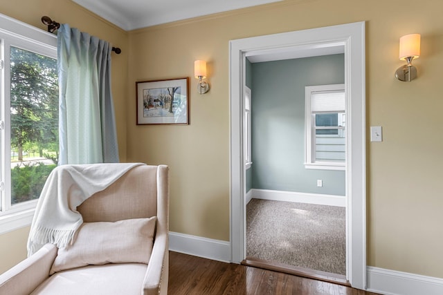 living area featuring wood finished floors and baseboards