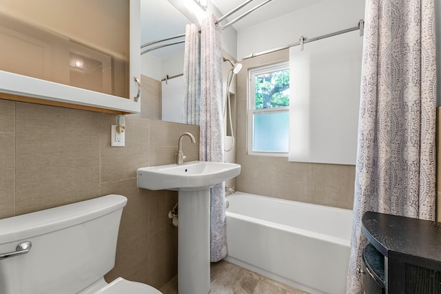full bath with toilet, shower / bath combo, tile walls, and tasteful backsplash