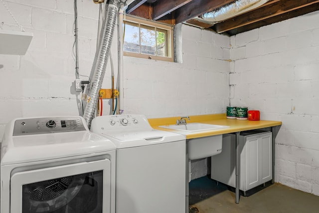 washroom featuring washer and clothes dryer