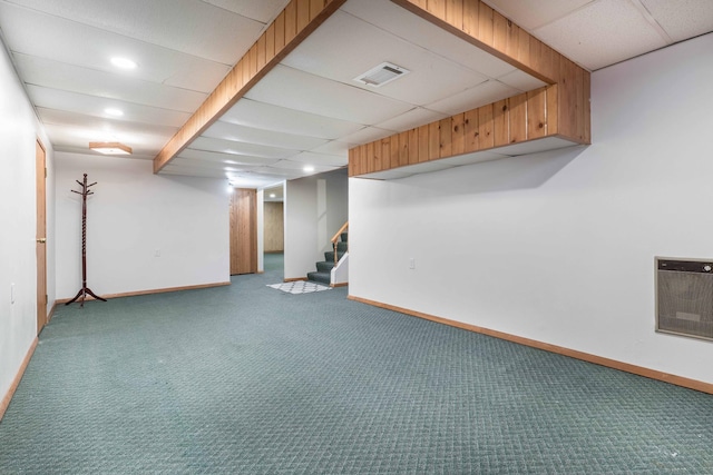 finished basement featuring baseboards, carpet, stairs, a paneled ceiling, and recessed lighting