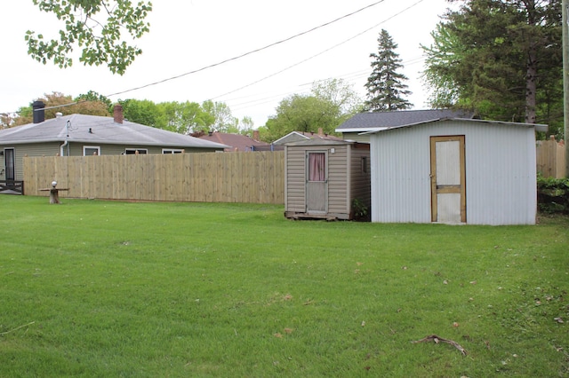 view of yard with a storage shed and an outdoor structure