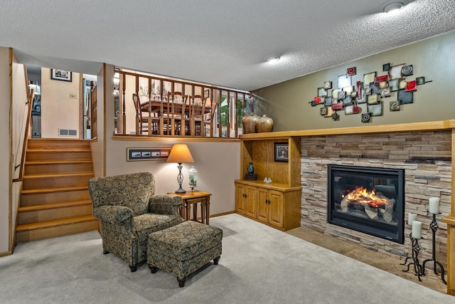 480 Suzanne Ave, Shoreview, MN 55126 - carpeted living area featuring a textured ceiling, stairway, and a stone fireplace