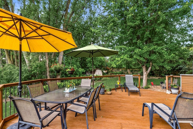 480 Suzanne Ave, Shoreview, MN 55126 - wooden terrace featuring outdoor dining space and view of wooded area