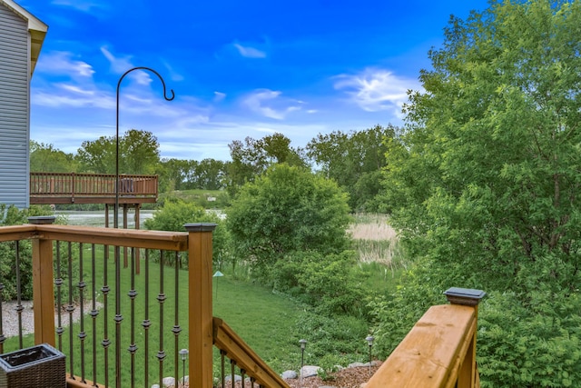 480 Suzanne Ave, Shoreview, MN 55126 - wooden deck with a lawn