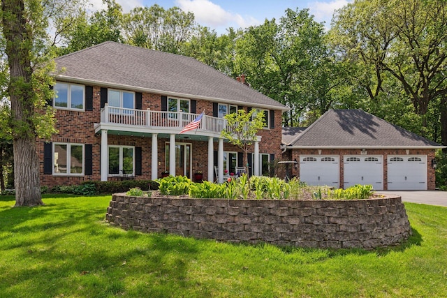 1438 Kings Wood Rd, Eagan, MN 55122 - view of front facade featuring brick siding, driveway, an attached garage, and a front yard