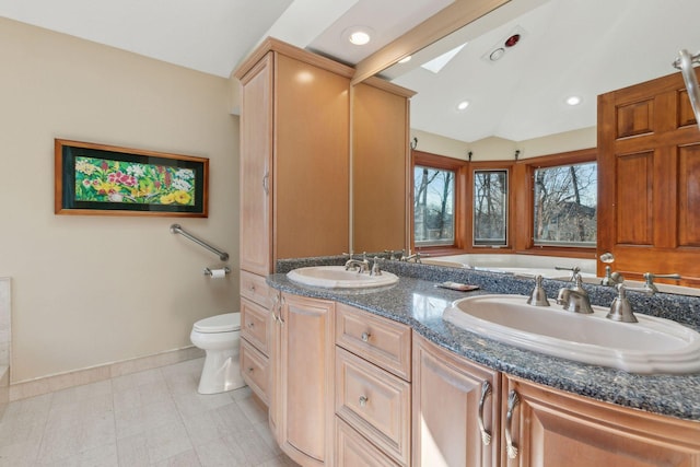 1438 Kings Wood Rd, Eagan, MN 55122 - full bath with toilet, baseboards, double vanity, lofted ceiling, and recessed lighting