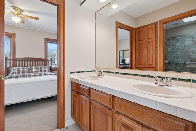 1438 Kings Wood Rd, Eagan, MN 55122 - ensuite bathroom featuring plenty of natural light, a ceiling fan, double vanity, a tile shower, and recessed lighting