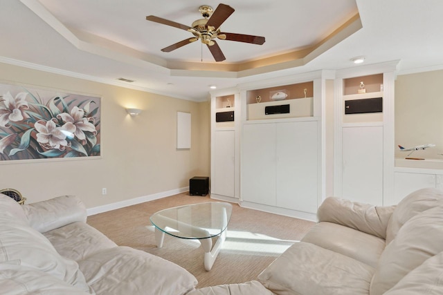 1438 Kings Wood Rd, Eagan, MN 55122 - living area featuring a tray ceiling, ceiling fan, crown molding, light carpet, and baseboards