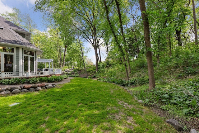 1438 Kings Wood Rd, Eagan, MN 55122 - view of green lawn with a pergola and a wooden deck