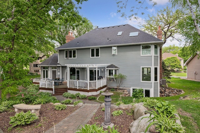 1438 Kings Wood Rd, Eagan, MN 55122 - rear view of property with a chimney, a deck, a pergola, a shingled roof, and cooling unit