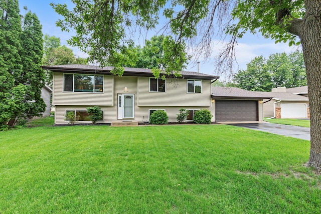 824 96th Ln NE, Blaine, MN 55434 - raised ranch featuring driveway, a front yard, and a garage