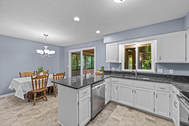 824 96th Ln NE, Blaine, MN 55434 - kitchen featuring appliances with stainless steel finishes, a peninsula, a textured ceiling, white cabinetry, and a chandelier