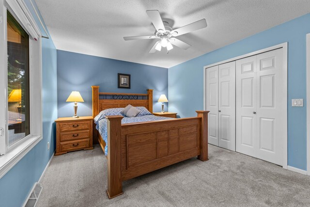 824 96th Ln NE, Blaine, MN 55434 - carpeted bedroom with a closet and ceiling fan