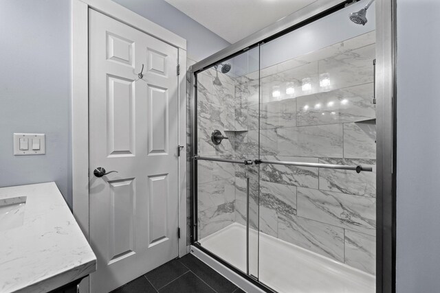 824 96th Ln NE, Blaine, MN 55434 - bathroom with a marble finish shower, tile patterned flooring, and vanity