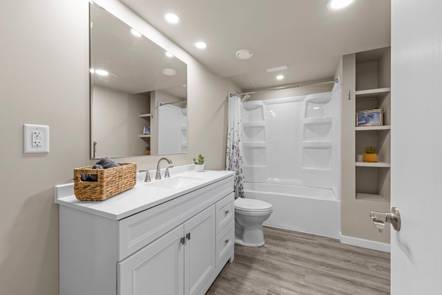 824 96th Ln NE, Blaine, MN 55434 - bathroom featuring vanity, wood finished floors, shower / bath combo, and recessed lighting