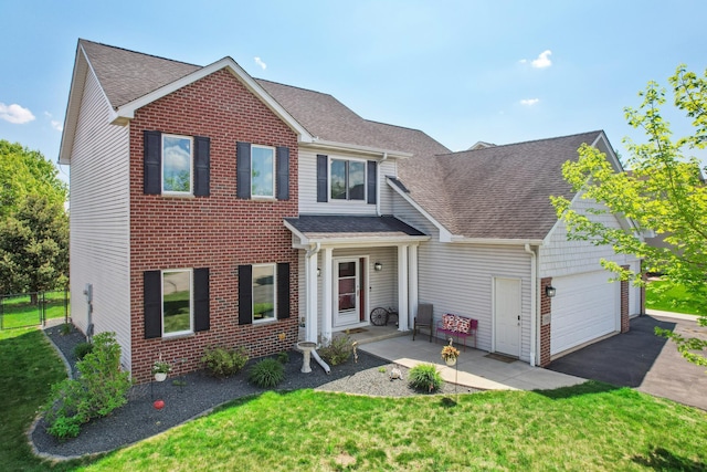 1005 Hope Ave, Jordan, MN 55352 - traditional-style house with roof with shingles, an attached garage, driveway, and brick siding