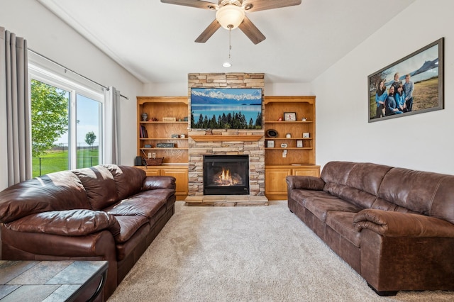 1005 Hope Ave, Jordan, MN 55352 - carpeted living area featuring ceiling fan and a stone fireplace
