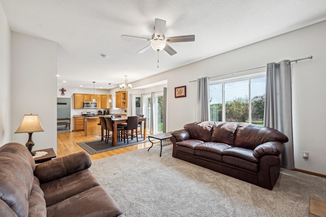 1005 Hope Ave, Jordan, MN 55352 - living room with ceiling fan, a chandelier, and recessed lighting