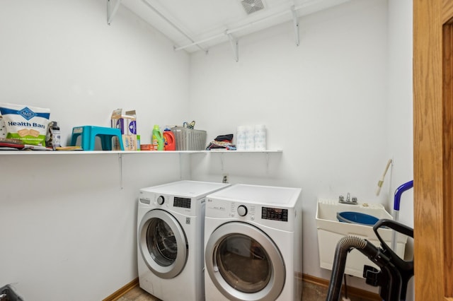 1005 Hope Ave, Jordan, MN 55352 - laundry room with separate washer and dryer and baseboards