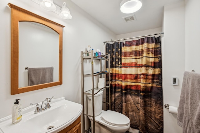 1005 Hope Ave, Jordan, MN 55352 - bathroom with toilet, vanity, and a shower with shower curtain