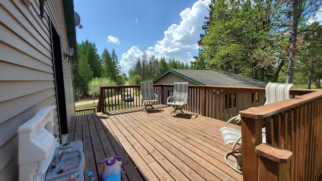 deck featuring view of scattered trees