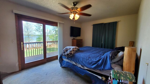 bedroom with access to exterior, carpet floors, and a ceiling fan