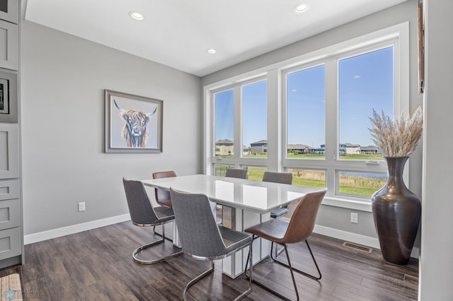 1991 69th Ave S, Fargo, ND 58104 - dining space with plenty of natural light, baseboards, dark wood-style floors, and recessed lighting