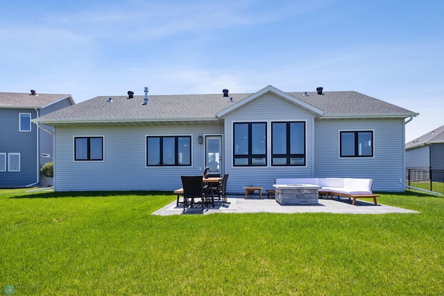 1991 69th Ave S, Fargo, ND 58104 - back of property featuring a patio area, a shingled roof, and an outdoor fire pit