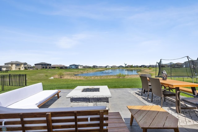 1991 69th Ave S, Fargo, ND 58104 - deck with a patio, a water view, a trampoline, and a yard