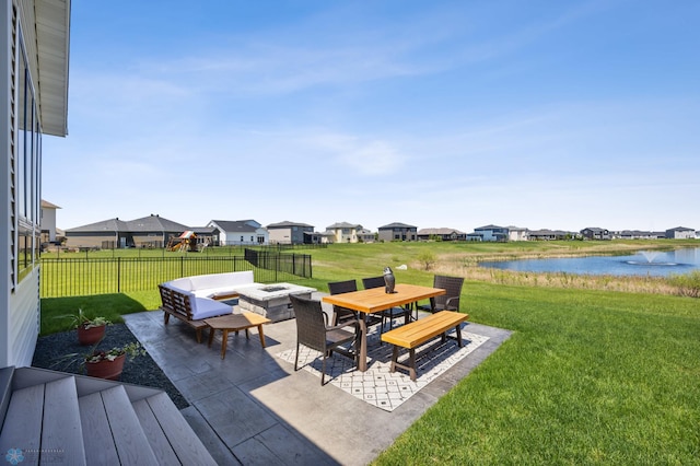 1991 69th Ave S, Fargo, ND 58104 - view of patio / terrace featuring a water view, a fire pit, outdoor dining space, and a residential view