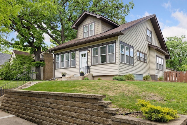 3313 Yosemite Ave S, Saint Louis Park, MN 55416 - bungalow-style home with central AC, entry steps, and a shingled roof