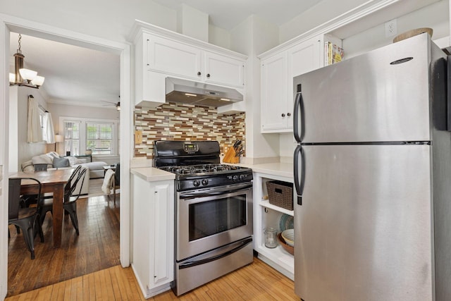 3313 Yosemite Ave S, Saint Louis Park, MN 55416 - kitchen featuring stainless steel appliances, under cabinet range hood, light countertops, white cabinets, and crown molding