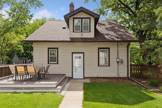 3313 Yosemite Ave S, Saint Louis Park, MN 55416 - rear view of house featuring a deck, a chimney, outdoor dining space, and a shingled roof