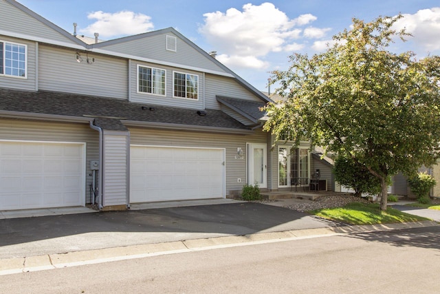 12977 Echo Ln, Apple Valley, MN 55124 - multi unit property featuring asphalt driveway, roof with shingles, and an attached garage