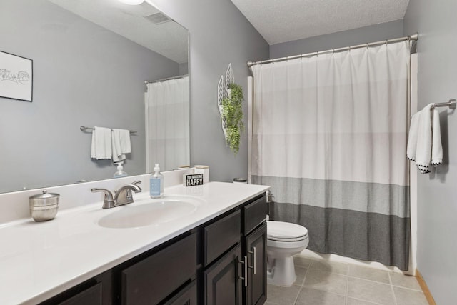 12977 Echo Ln, Apple Valley, MN 55124 - full bathroom featuring vanity, toilet, tile patterned floors, and a textured ceiling