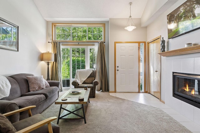 12977 Echo Ln, Apple Valley, MN 55124 - living room featuring light tile patterned flooring, a tile fireplace, and baseboards