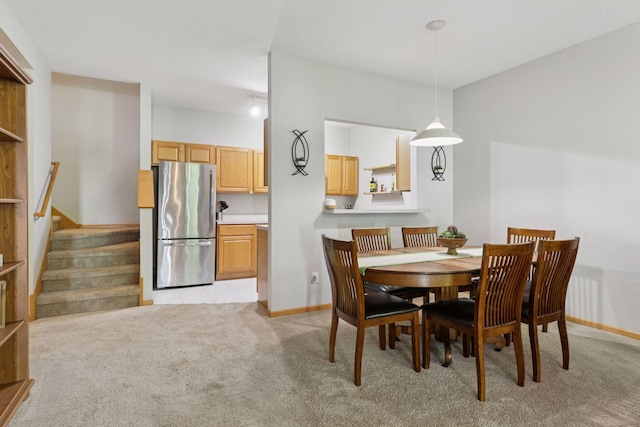 12977 Echo Ln, Apple Valley, MN 55124 - dining space featuring light carpet, stairway, and baseboards