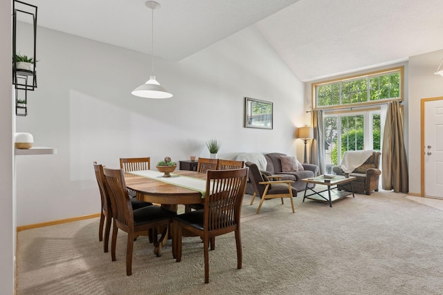 12977 Echo Ln, Apple Valley, MN 55124 - carpeted dining room featuring high vaulted ceiling and baseboards