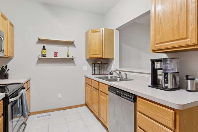 12977 Echo Ln, Apple Valley, MN 55124 - kitchen with appliances with stainless steel finishes, a sink, light countertops, light tile patterned floors, and baseboards