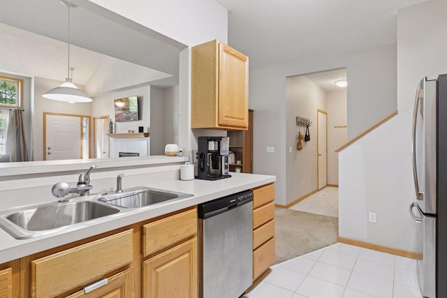 12977 Echo Ln, Apple Valley, MN 55124 - kitchen with appliances with stainless steel finishes, a sink, light tile patterned floors, light brown cabinets, and light countertops