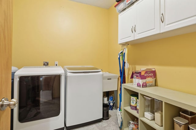 12977 Echo Ln, Apple Valley, MN 55124 - washroom featuring washing machine and dryer and cabinet space