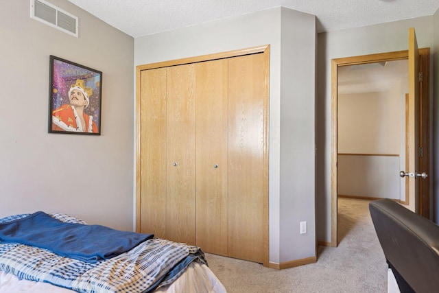 12977 Echo Ln, Apple Valley, MN 55124 - carpeted bedroom with a closet, baseboards, and a textured ceiling