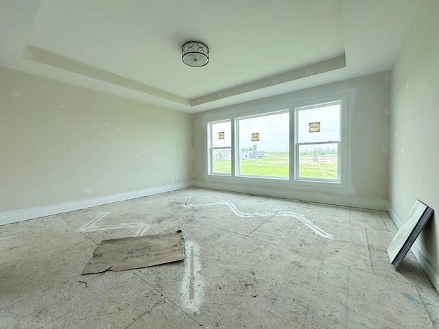 17970 103rd Ave N, Maple Grove, MN 55311 - spare room with a tray ceiling and baseboards