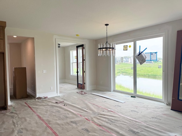 17970 103rd Ave N, Maple Grove, MN 55311 - unfurnished dining area featuring a chandelier and baseboards