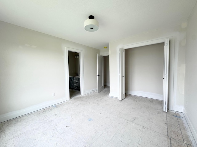 17970 103rd Ave N, Maple Grove, MN 55311 - unfurnished bedroom with baseboards and ensuite bathroom