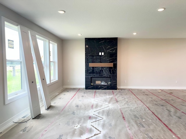 17970 103rd Ave N, Maple Grove, MN 55311 - unfurnished living room with recessed lighting and a fireplace